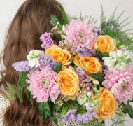 Beautiful bunch of pastel flowers in a bunch including yellow roses pink chrysanthemums